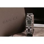 A Gucci ladies stainless steel wristwatch, ref. 2305L, circa 2001, with named black dial, on a