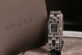 A Gucci ladies stainless steel wristwatch, ref. 2305L, circa 2001, with named black dial, on a