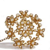 A Victorian pearl set brooch, formed of multiple flower heads,7.4 grams, 29mm diameter