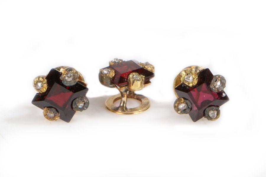 A set of three Edwardian garnet and diamond set studs, square cut garnets with four diamonds to - Image 3 of 6