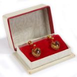 Pair of  9 carat gold stone set earrings, the yellow stones cut into heart shapes mounted to 9 carat