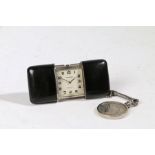 A Movado Chronometre Ermeto silver purse watch, the polished black case opening to reveal a signed