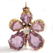 An amethyst and diamond set brooch,  in the form of a flower with central diamond, 3.4 grams, 18mm