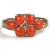 A Victorian 15 carat gold and coral set ring, with six coral beads and a central diamond, 4.2 grams,