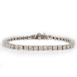 A good diamond set tennis bracelet, with a row of forty-five round cut diamonds at approximately 0.