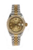 A lady's Rolex Datejust bi-metal and diamond wristwatch, the signed gilt dial with diamond