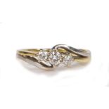 An 18 carat gold diamond set ring, with three round cuts diamonds to the angled head, 3.2 grams,