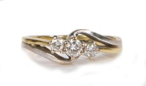 An 18 carat gold diamond set ring, with three round cuts diamonds to the angled head, 3.2 grams,