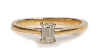 A baguette diamond solitaire ring, set with four claws, 2.2 grams, ring size K