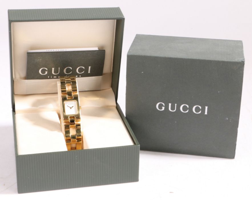 A Gucci ladies gilt stainless steel wristwatch, ref. 2305L, circa 1998, with named white dial, on