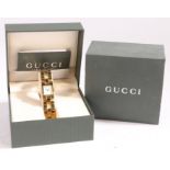 A Gucci ladies gilt stainless steel wristwatch, ref. 2305L, circa 1998, with named white dial, on