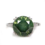 A rare and impressive 5.95 carat green diamond solitaire ring, the round brilliant cut green diamond