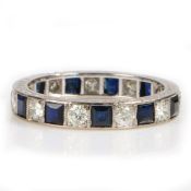 A Sapphire and Diamond set eternity ring, with interspersed sapphires and diamonds to the shank, 3.4