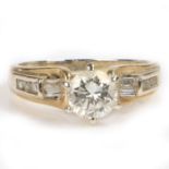 A 14 carat gold diamond solitaire ring, the round cut diamond at approximately 0.8 carats with