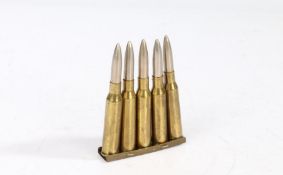 Five Second World War Japanese Arisaka rounds in brass charger clip, inert