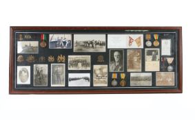 Framed First World War display including two pairs 1914-1918 British War Medal and Victory Medals (