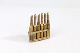 Italian 1927 dated charging clip with six 6.5mm Carcano rounds, inert