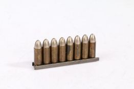 Rare charger clip of eight First World War dated 9 x 25mm rounds for the Mauser C96 semi automatic
