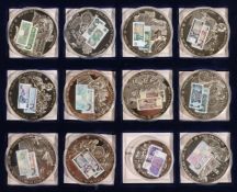 A set of twelve British banknote commemorative coins, cased