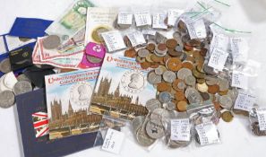 A collection of GB and world coins and banknotes, to include commemorative crowns, uncirculated