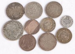 A collection of World coins, to include a 1883 US Dollar, South African 2 1/2 Shillings, 2