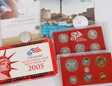 United States Mint 2005 silver proof set, containing five silver quarters, a silver dime and a