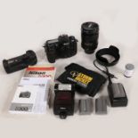 Nikon D300 digital SLR camera body with a Nikon AF-S NIKKOR 28-300mm f/3.5-5.6G ED VR lens, Nikon