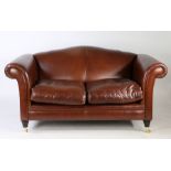 Laura Ashley Gloucester brown leather two seater sofa in good condition. Castors to the front