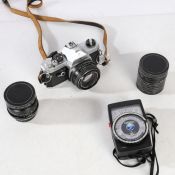 Pentax MX 35mm film SLR camera with a SMC Pentax-M 1:1.7 50mm lens, an RMC Tokina 28mm lens, a