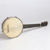 The Whirle Ukulele Banjo by Windsor, Birmingham with a fitted case. Instrument measuring 55cm in