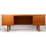 A large mid Century teak desk. 184cm wide x 71cm high x 92cm deep.