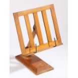 An adjustable oak reading stand marked '"LUMINE" PATENT NO. 20550/11 REG. DESIGN'.