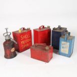 A collection of oil cans, pouring cans, and an Esso oil pump. To include examples from Shell,