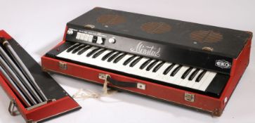 Eko Minstrel electric organ, with red and black case and four detachable legs, 73.5cm wide