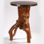 A root wood table, the circular top above a natural wood base, 41.5cm diameter, 60cm high