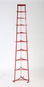 Clark & Co red painted metal saucepan stand. 189cm tall.