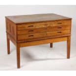 20th century light oak plans chest, fitted with three long drawers and raised on square legs,