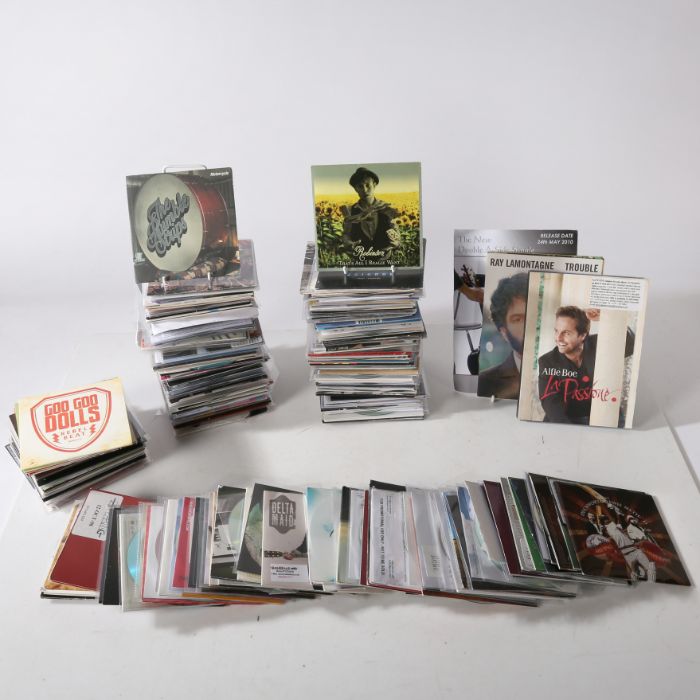 A collection of assorted CD samplers and advance copies, in paper/ plastic sleeves, approx. 200 in