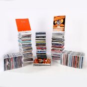 A collection of assorted CD samplers and advance copies in cases, approx. 200 in total.