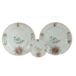 A set of three Chinese export armorial plates, Qing Dynasty, to include two chargers with a fort