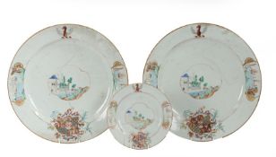 A set of three Chinese export armorial plates, Qing Dynasty, to include two chargers with a fort