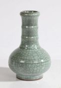 A Chinese crackle glaze porcelain vase, with a long neck and two bands above the squat body and ring