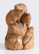 A Japanese Meiji boxwood carving depicting five rats, the largest standing on an apple, signed to an