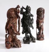Three Chinese carvings, two carved as scholars one with wirework inlay, the third carved as a