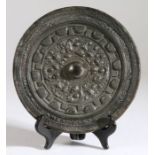 A large Huaxiang bronze mirror, (Banyuan Fangjiao Dai) Six Dynasties Period (220-589) cast with