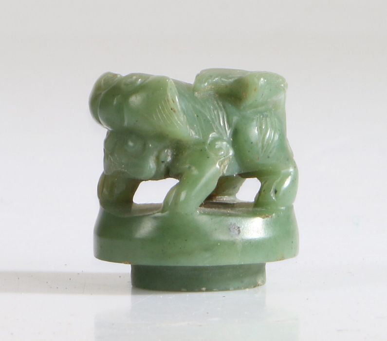 Chinese jade dog of foo, Qing Dynasty, Kuang Hsu, (1875 - 1908) carved in a standing position, a rim