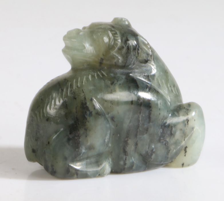 A Chinese jade reclining mythical beast, green and black grained colour, carved into a crouching - Image 2 of 2