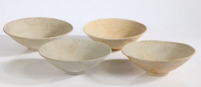 A set of four Song Dynasty bowls, probably shipwreck pieces, with incised decoration, 25cm wide, (