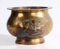 A Chinese bronze censer, the flared lip above mask handles and bulbous body, 24cm wide, 13.5cm high