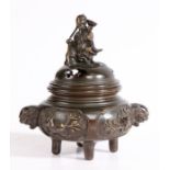 A Japanese bronze censer, Edo period, the lid surmounted by a figure holding a bowl and staff